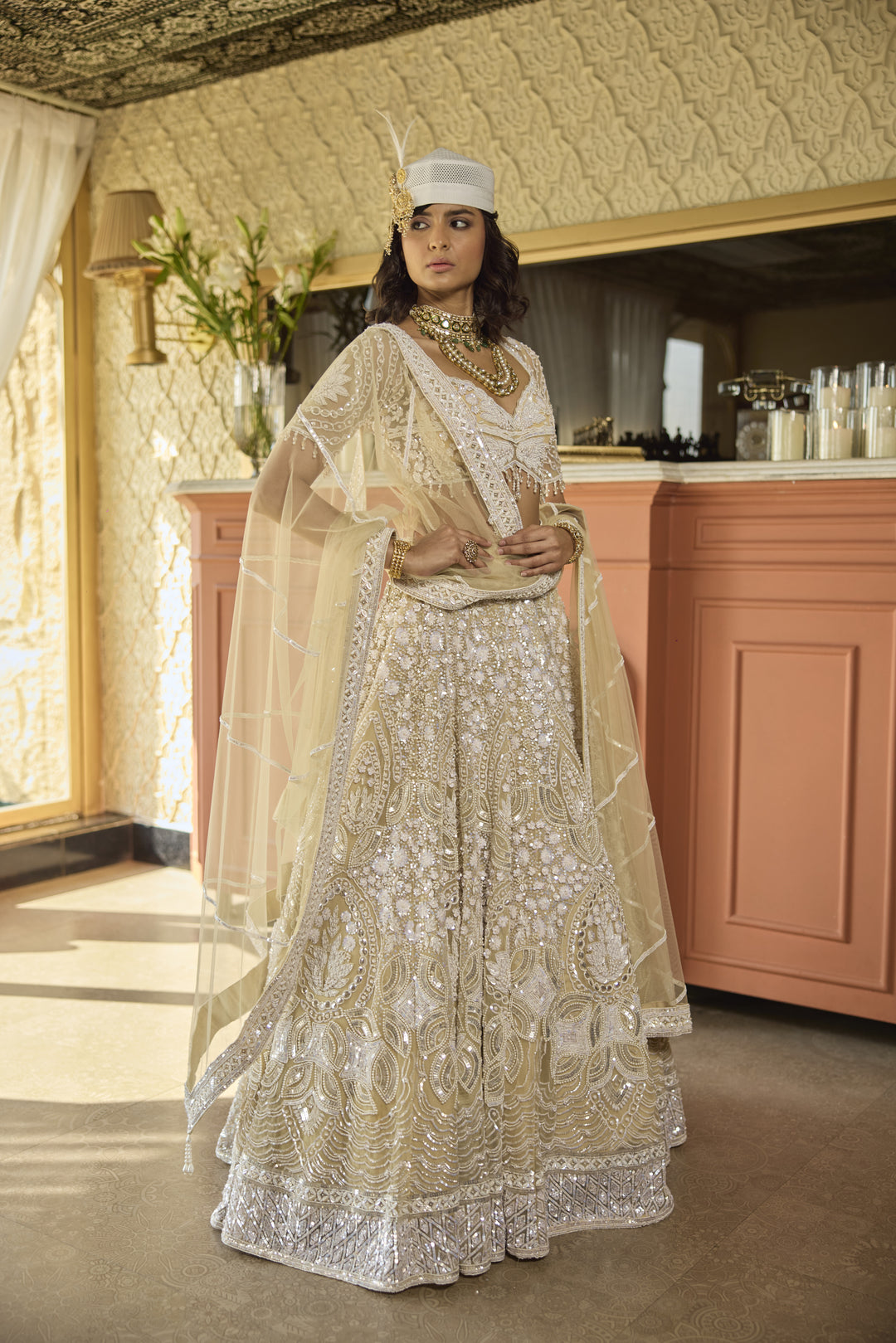 Regal Ivory Net Lehenga with Pearl & Sequin Embellishments