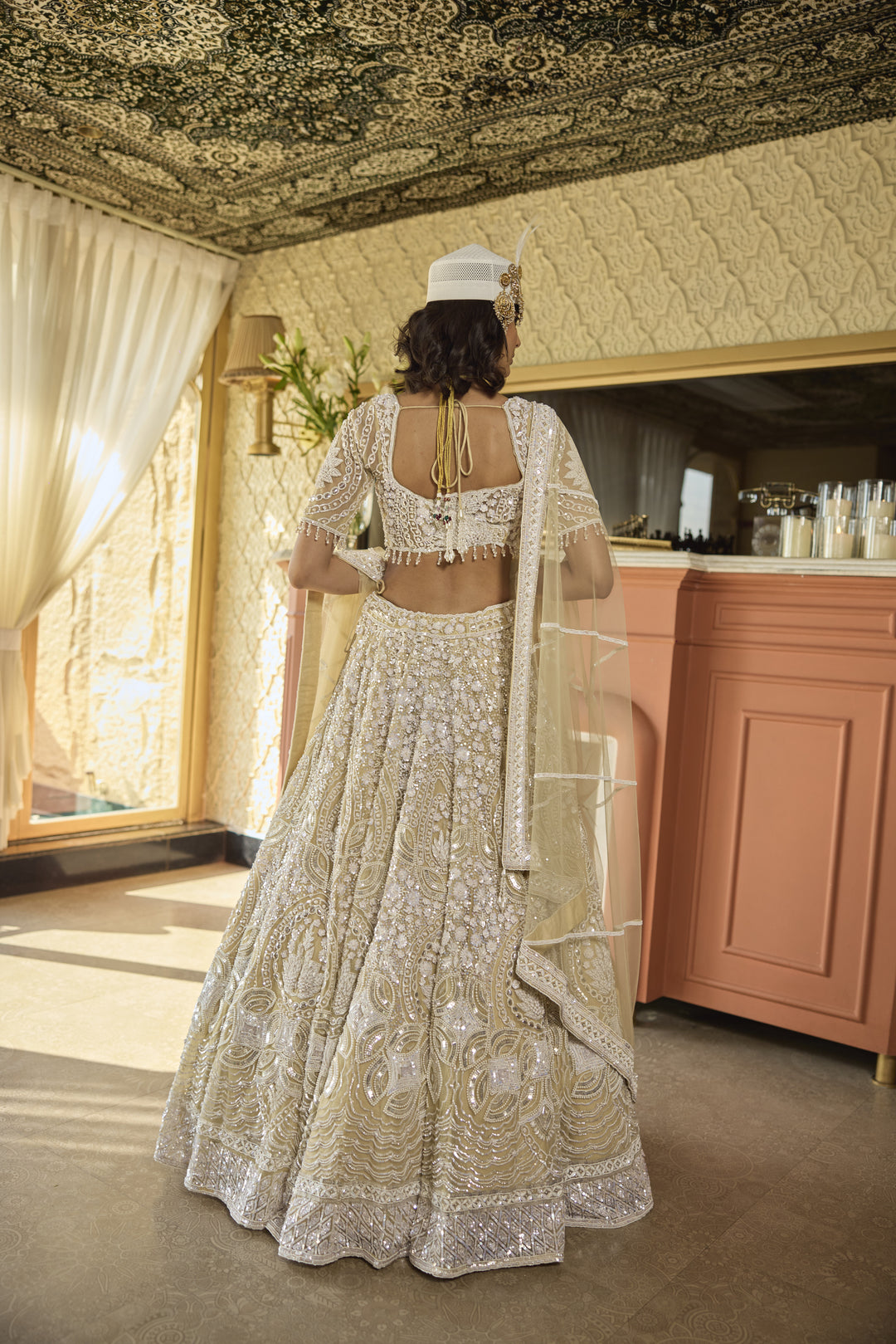 Regal Ivory Net Lehenga with Pearl & Sequin Embellishments