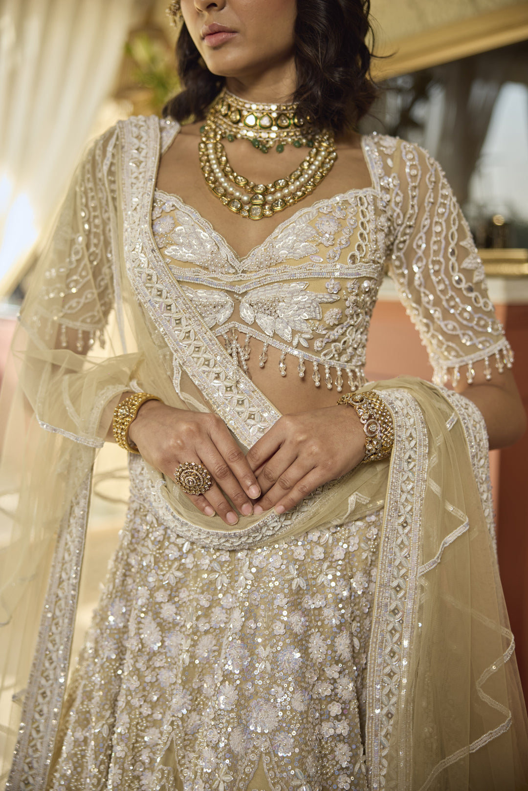 Regal Ivory Net Lehenga with Pearl & Sequin Embellishments